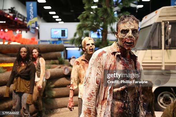 Cosplayers dressed as zombies from "The Walking Dead" attend Comic-Con International 2016 on July 24, 2016 in San Diego, California.