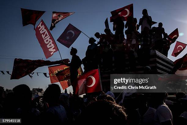 Members of both the Republican People's Party and President Erdogan's AKP Party wave flags during the "Republic and Democracy" rally held at Taksim...