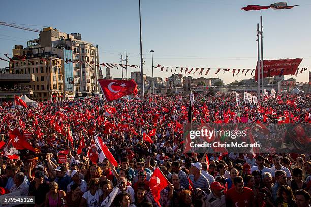 Thousands of supporters from both the Republican People's Party and President Erdogan's AKP Party wave flags during the "Republic and Democracy"...