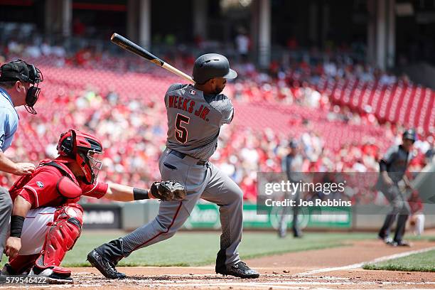 Rickie Weeks Jr. #5 of the Arizona Diamondbacks drives in a run with a single to left field in the first inning against the Cincinnati Reds at Great...