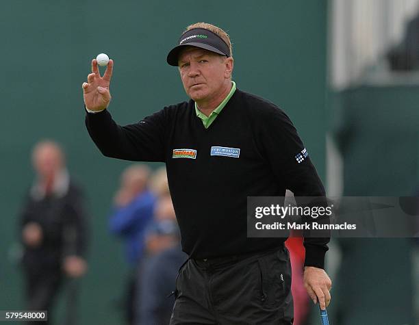 Paul Broadhurst of England reacts after sinking a putt on 16 during the final day of The Senior Open Championship at Carnoustie Golf Club on July 24,...