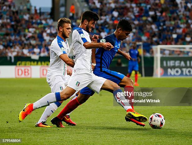 Ludovic Blas of France is challenged by Alberto Picchi of Italy during the UEFA Under19 European Championship Final match between U19 France and U19...