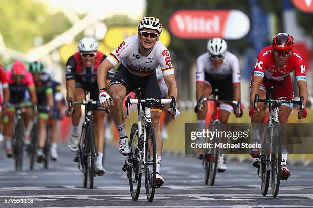 Andre Greipel of Germany and Lotto-Soudal croses the finish line to win stage twenty one of the 2016 Le Tour de France, from Chantilly to Paris...