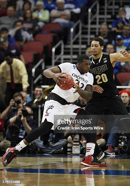 Cincinnati Bearcats center Coreontae DeBerry drives to the basket against Purdue Boilermakers center A.J. Hammons in a second-round NCAA Tournament...