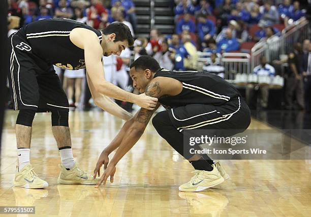 Purdue Boilermakers guard Dakota Mathias consoles teammate Vince Edwards after a loss in a second-round NCAA Tournament game between the Purdue...