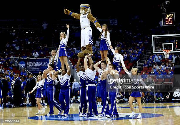 The Kentucky Wildcats mascot and cheerleaders perform a pyramid during a second-round NCAA Tournament game between the Hampton University Pirates and...