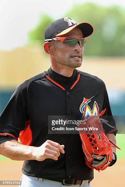 Ichiro Suzuki of the Miami Marlins warms up before the spring training game between the Miami Marlins and the Atlanta Braves at Champion Stadium in...