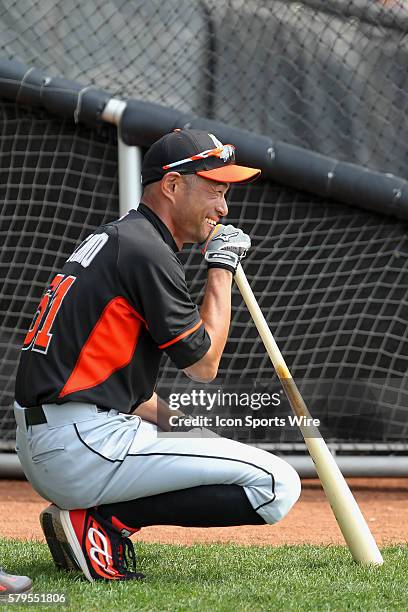 Ichiro Suzuki of the Miami Marlins warms up before the spring training game between the Miami Marlins and the Atlanta Braves at Champion Stadium in...