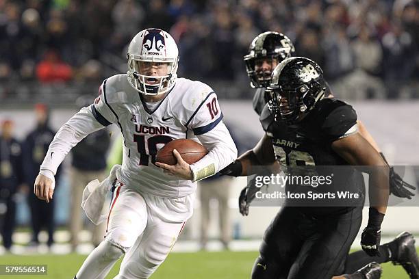 Uconn Huskies Quarterback Chandler Whitmer runs the ball during a NCAA football game between the UConn Huskies and the Army Black Knights at Yankee...