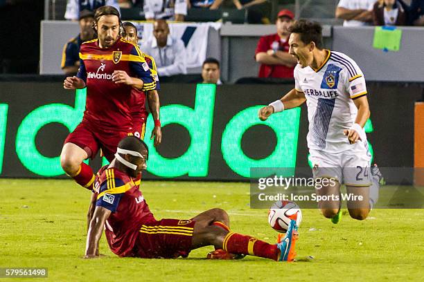 Real Salt Lake defender Chris Schuler tackles Los Angeles Galaxy midfielder Stefan Ishizaki and sends him to the ground during the Western Conference...