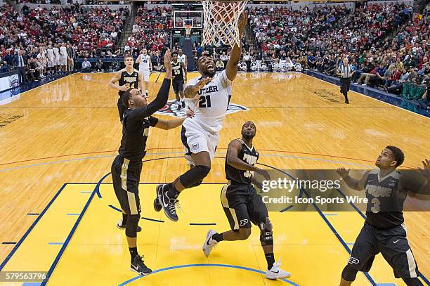 Butler University guard Roosevelt Jones drives by Purdue Boilermakers guard Kendall Stephens and Purdue Boilermakers guard Rapheal Davis during the...