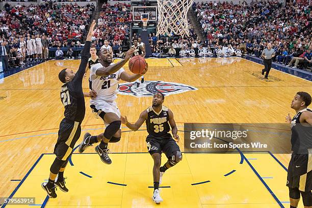 Butler University guard Roosevelt Jones drives by Purdue Boilermakers guard Kendall Stephens and Purdue Boilermakers guard Rapheal Davis during the...