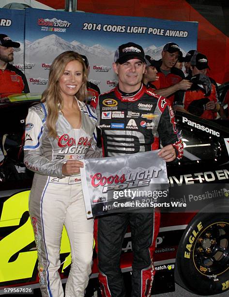 Jeff Gordon, driver of the No.24 Drive to End Hunger Chevy, celebrates winning the pole for the NASCAR Sprint Cup Series - Ford EcoBoost 400 at...