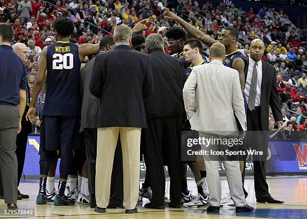 March 22, 2015; West Virginia Mountaineers huddle up during the game between the West Virginia Mountaineers and the Maryland Terrapins in the Thrid...