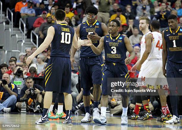 March 22, 2015; West Virginia Mountaineers guard Juwan Staten and West Virginia Mountaineers guard Chase Connor during the game between the West...