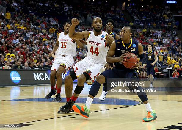 March 22, 2015; Maryland Terrapins guard/forward Dez Wells and West Virginia Mountaineers guard Jevon Carter during the game between the West...