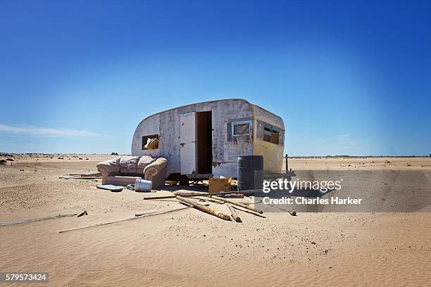 abandoned homeless trailer in desert sand - sonora stock pictures, royalty-free photos & images