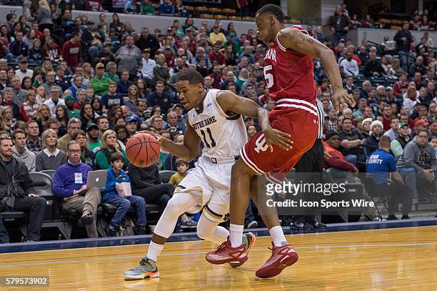Notre Dame Fighting Irish guard Demetrius Jackson drives by Indiana Hoosiers forward Troy Williams during the Crossroads Classic NCAA basketball game...