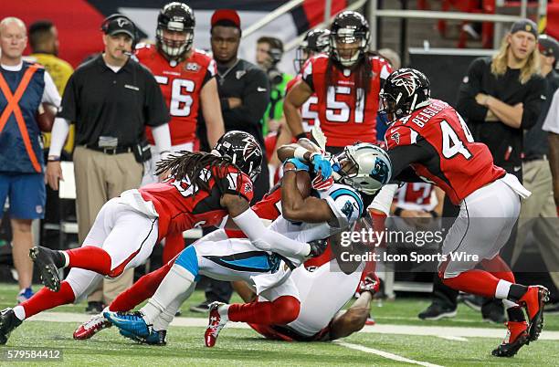 Carolina Panthers running back Fozzy Whittaker is tackled before getting a first down during the first quarter of the NFL game between the Carolina...