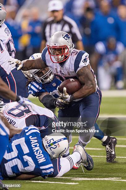 New England Patriots running back Jonas Gray gets away from Indianapolis Colts outside linebacker Erik Walden during a football game between the...