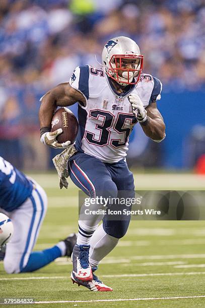 New England Patriots running back Jonas Gray breaks free for a big gain during a football game between the Indianapolis Colts and New England...