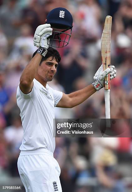 Alastair Cook of England celebrates scoring a century during the first day of the second test between England and Pakistan at Old Trafford on July...