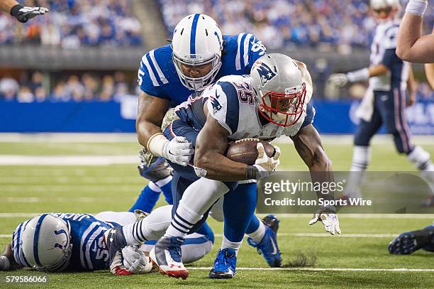 Indianapolis Colts defensive end Fili Moala tackles New England Patriots running back Jonas Gray during a football game between the Indianapolis...