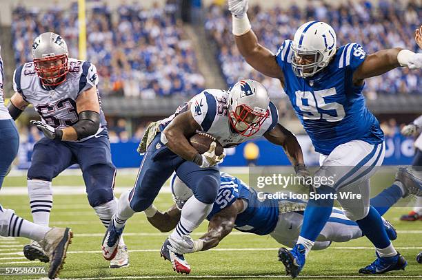 Indianapolis Colts defensive end Fili Moala tries to tackle New England Patriots running back Jonas Gray during a football game between the...