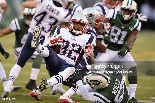 New York Jets Defensive End Trevor Reilly [11167] puts the hard hit on New England Patriots Wide Receiver Keshawn Martin [17744] on the kickoff...