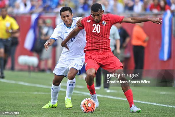 Panama midfielder An??bal Godoy tries to keep the ball away from Honduras Midfielder andy najar during the Panama game against Honduras in the...