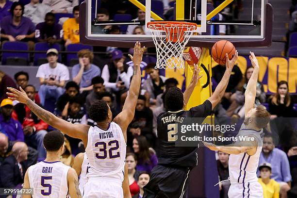 December 29 - Wake Forest Demon Deacons forward Devin Thomas drives to the basket against LSU Tigers forward Craig Victor II during the NCAA...