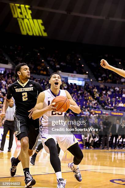 December 29 - LSU Tigers forward Ben Simmons drives to the basket against Wake Forest Demon Deacons forward Devin Thomas during the NCAA basketball...