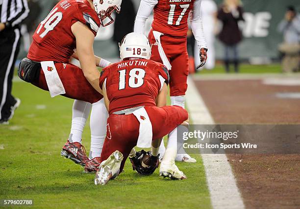 Louisville Cardinals tight end Cole Hikutini downs the ball on the one yard line during an college football game between the Louisville Cardinals and...