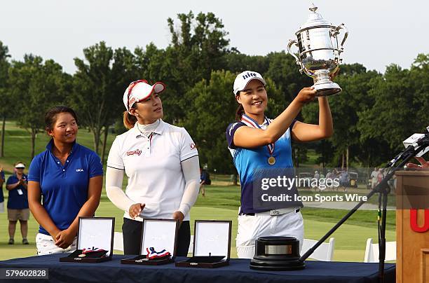 In Gee Chun hoists the Harton S. Simple trophy after winning the 70th U.S. Women's Open with by shooting -8 for the tournament at Lancaster Country...