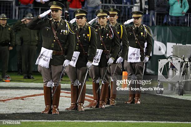 Texas A&M Aggies Mid-shipmen salute during the Nation Anthem before the Franklin American Mortgage Music City Bowl match-up between Texas A&M and...