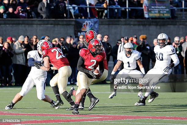 Harvard's Andrew Flesher cuts back across the grain. The Harvard Crimson defeated the Yale Bulldogs 31-24 in the 131st edition of The Game at Harvard...