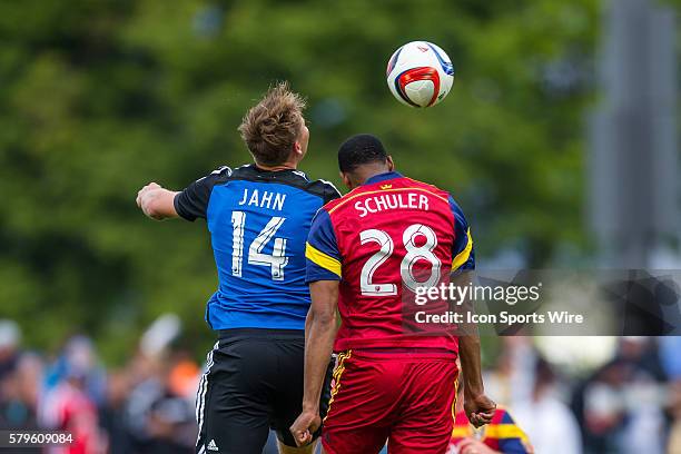 San Jose Earthquakes forward Adam Jahn and Real Salt Lake defender Chris Schuler battle for aerial possession, during a major league soccer game...