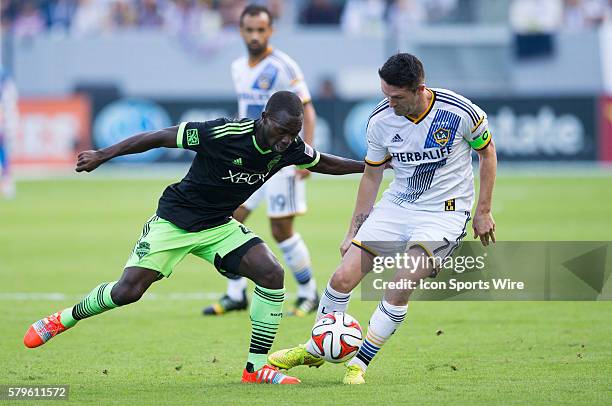 November 23, 2014 - Los Angeles Galaxy forward Robbie Keane gains control of the ball, while Seattle Sounders FC midfielder Micheal Azira brings...