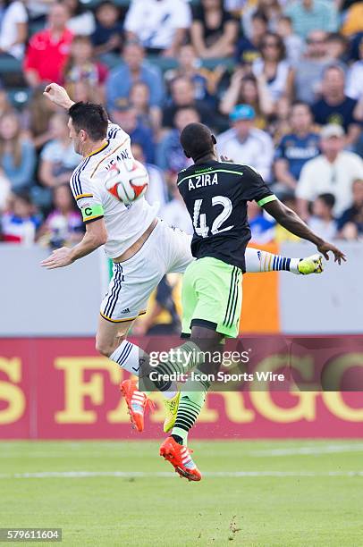 November 23, 2014 - Los Angeles Galaxy forward Robbie Keane and Seattle Sounders FC midfielder Micheal Azira jump up in the air to hit a header...