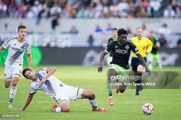 November 23, 2014 - Seattle Sounders FC forward Obafemi Martins jumps over Los Angeles Galaxy defender Omar Gonzalez during the Western Conference...