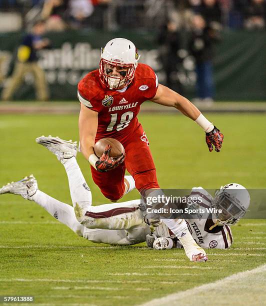 Cole Hikutini catches the ball in the Franklin American Mortgage Music City Bowl between the Texas A&M Aggies and Louisville Cardinals at Nissan...