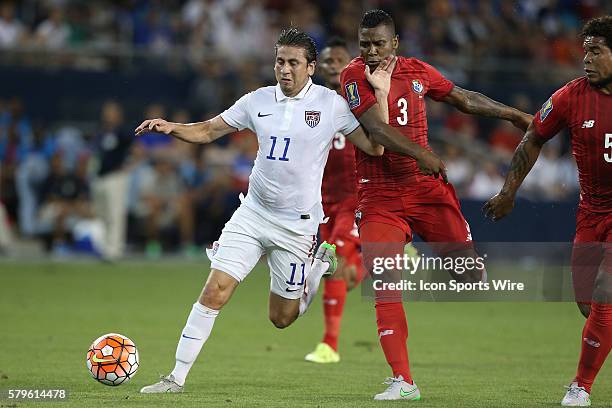 Alejandro Bedoya is held by Harold Cummings . The United States Men's National Team played the Panama Men's National Team at Sporting Park in Kansas...