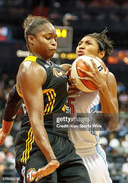 Atlanta's Angel McCoughtry runs into Tulsa's Karima Christmas in Atlanta Dream 85-75 loss to the Tulsa Shock at Philips Arena in Atlanta, GA.