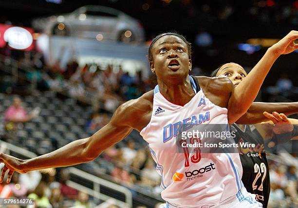 Tulsa's Plenette Pierson is getting blocked out by Atlanta's Aneika Henry in Atlanta Dream 85-75 loss to the Tulsa Shock at Philips Arena in Atlanta,...