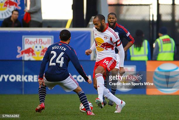 New York Red Bulls' Thierry Henry marked by New England Revolution's Lee Nguyen . The New England Revolution defeated the New York Red Bulls 2-1 in...
