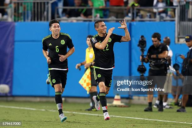 Paul Aguilar celebrates his goal with Hector Herrera . The Mexico Men's National Team played the Trinidad & Tobago Men's National Team at Bank of...