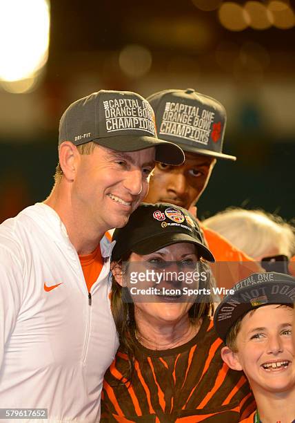 Clemson Tigers Head Coach Dabo Swinney smiles as he poses with his wife Kathleen Swinney and his son along with Clemson Tigers Quarterback Deshaun...