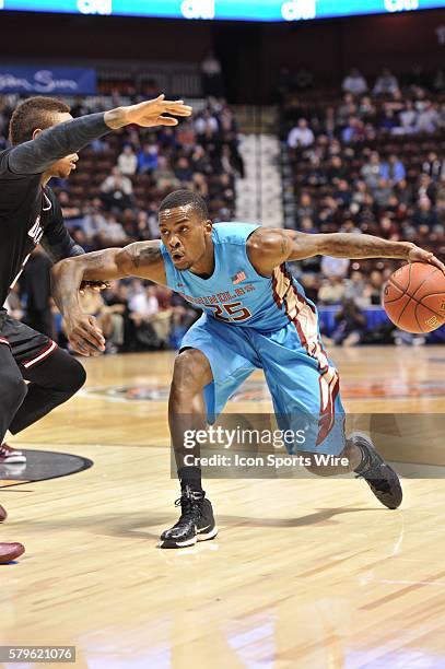 Florida State Seminoles guard Aaron Thomas tries to get around Massachusetts Minutemen guard Derrick Gordon with the ball during the Florida State...