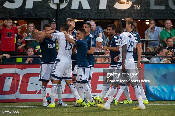 Matias Laba of Vancouver Whitecaps celebrates his goal with team mates and visiting fans - Providence Park, Portland, OR