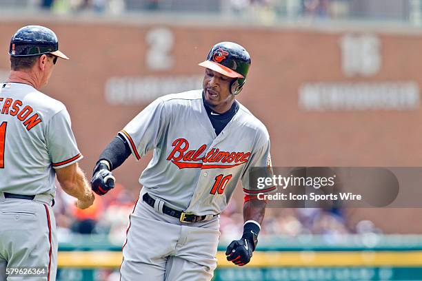 Baltimore Orioles center fielder Adam Jones celebrates his home run in the first inning rounding third base, during the Baltimore Orioles at Detroit...